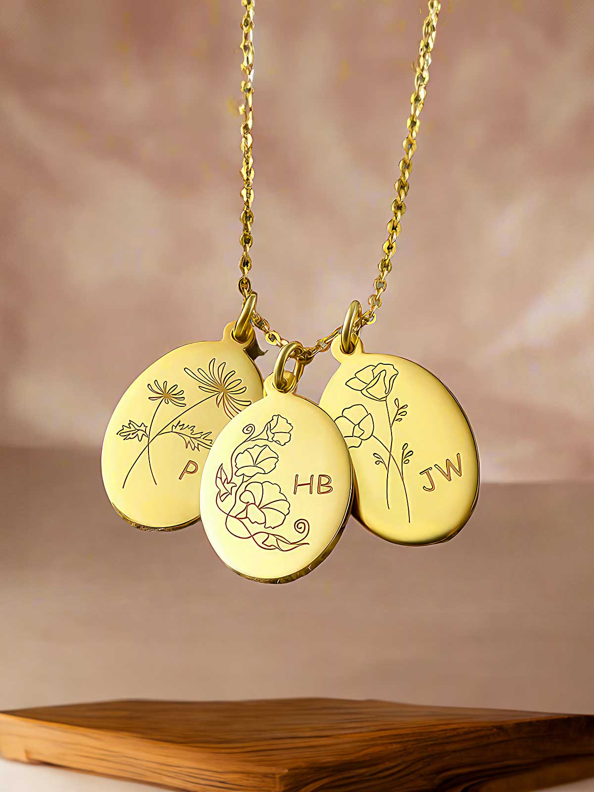 a couple of necklaces sitting on top of a wooden table