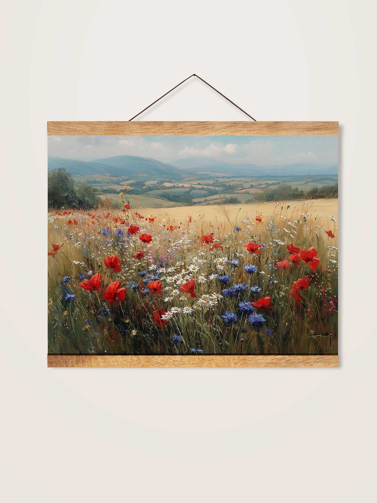 A framed painting depicting a vibrant field of red poppies and blue and white flowers against a backdrop of rolling hills and a blue sky.
