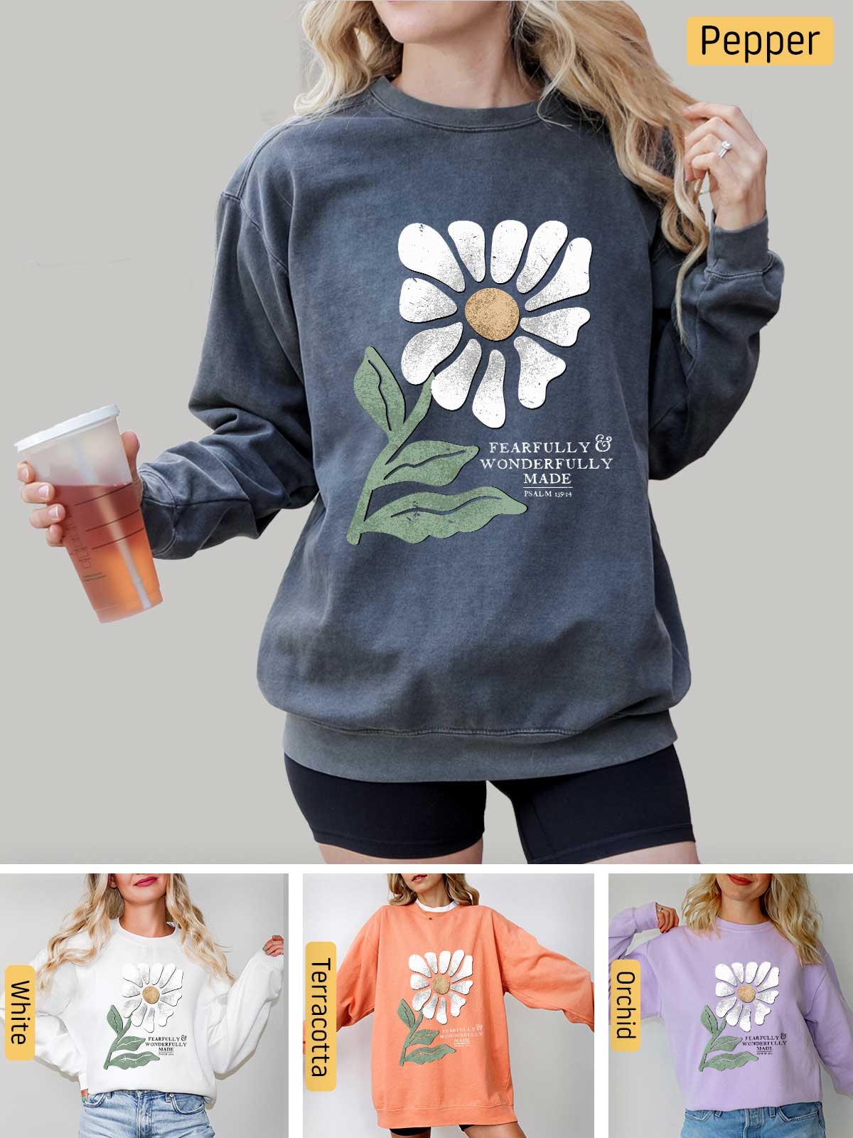 a woman wearing a sweatshirt with a flower on it