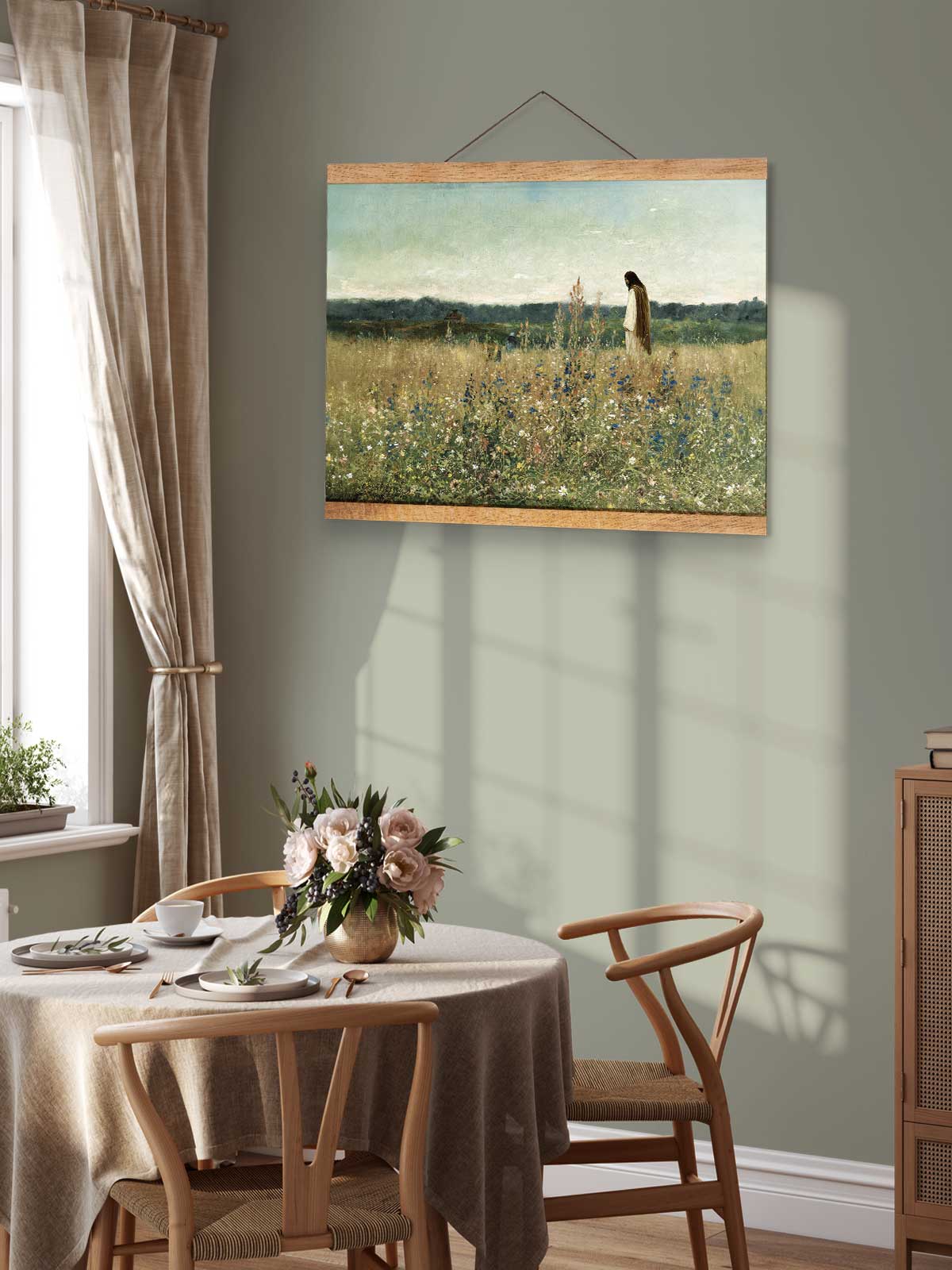 a serene dining room with a table set for two, featuring a vase of flowers and a painting of a woman in a field.