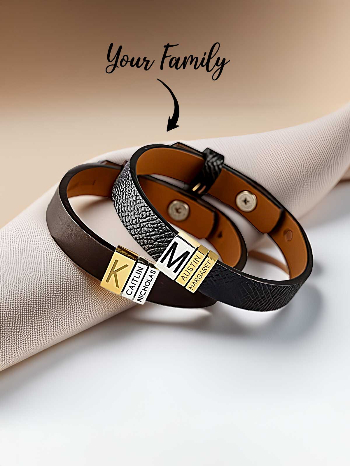 a couple of bracelets sitting on top of a napkin