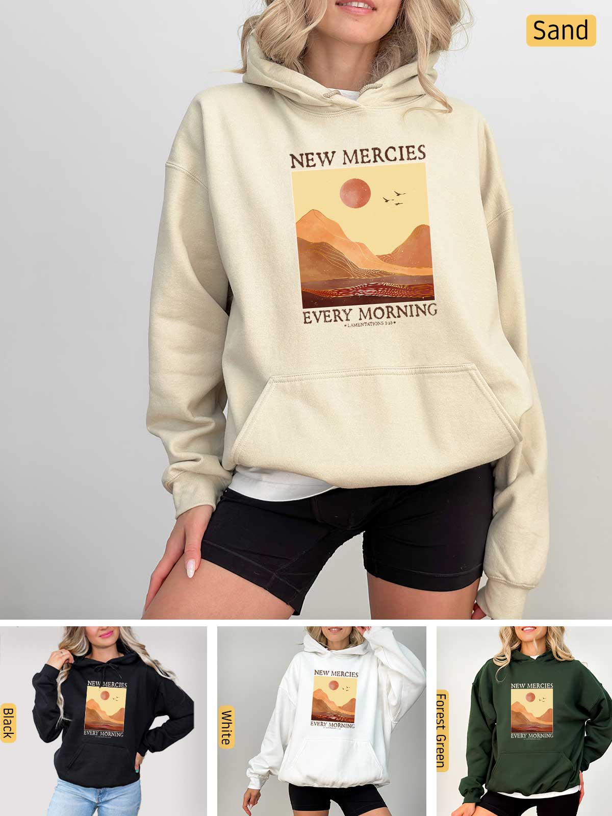 a woman wearing a new mercies sweatshirt and shorts