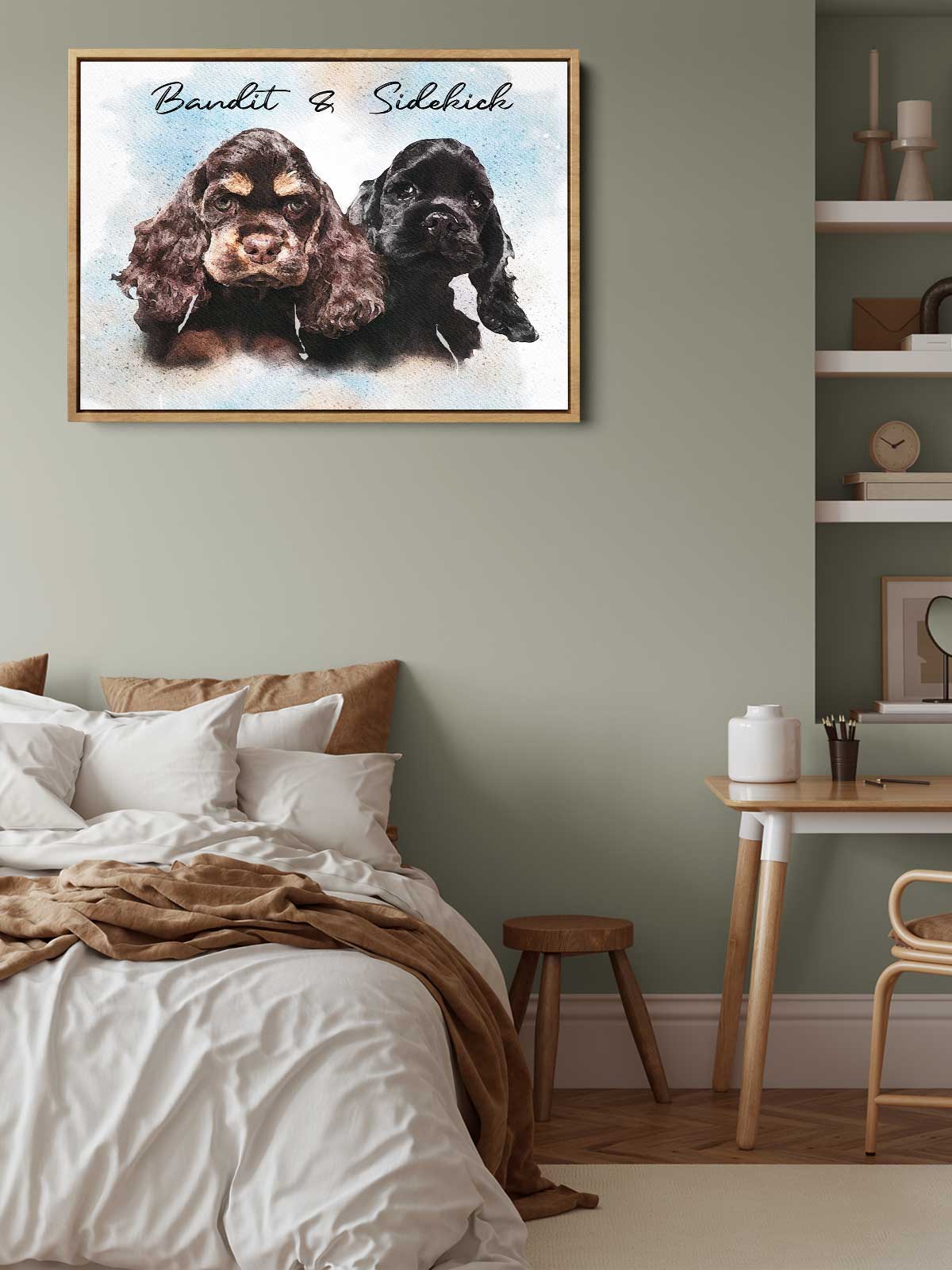 two dogs, one brown and one black, sitting together in a framed artwork on a wall above a bed.