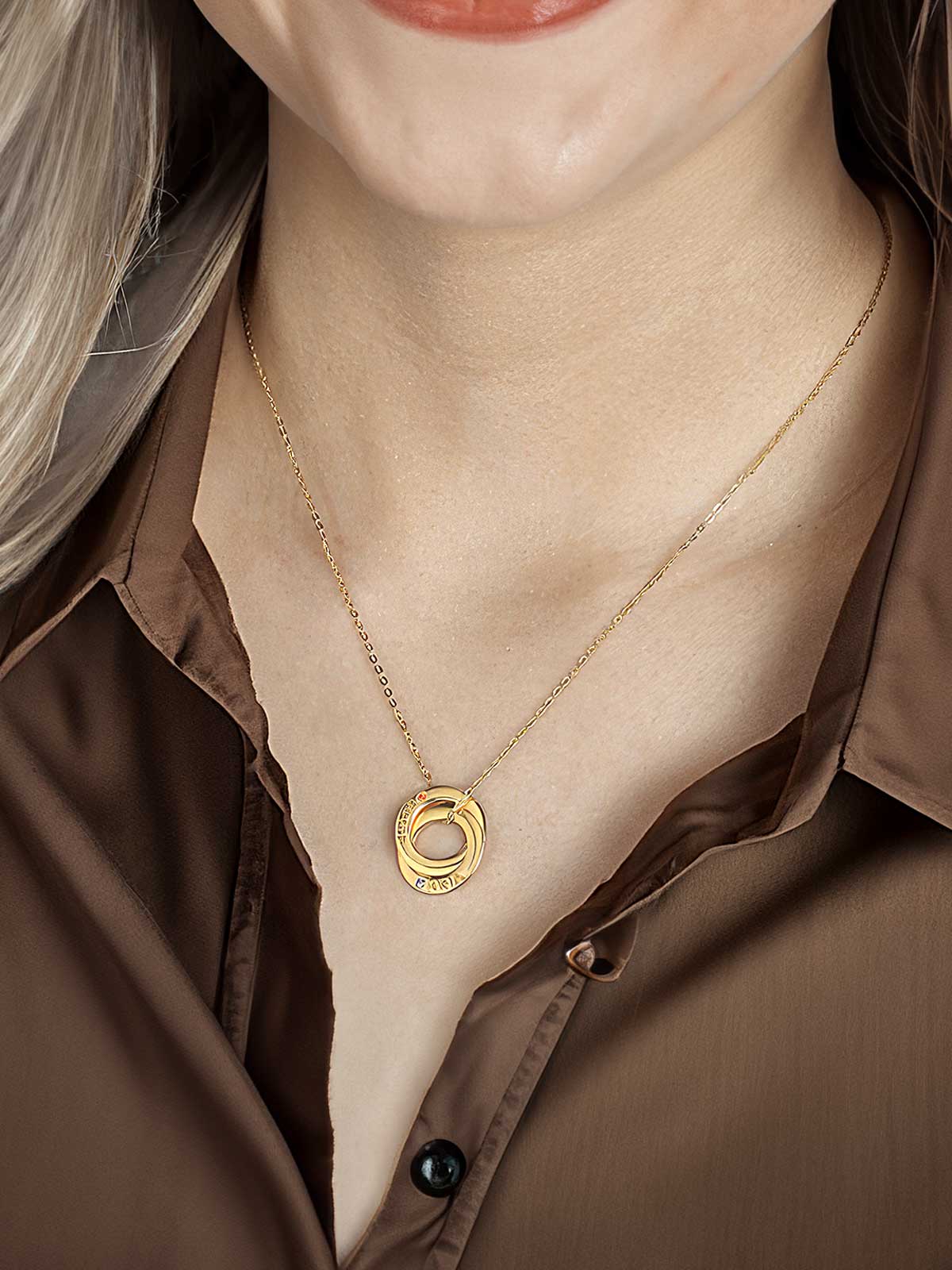 a close up of a woman wearing a necklace