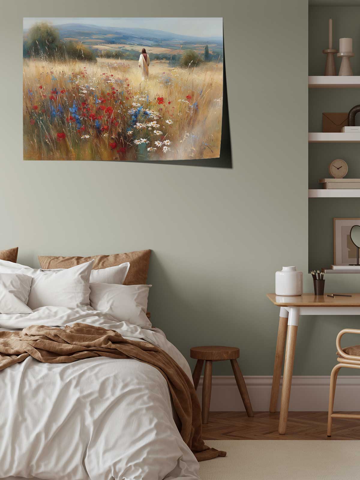 a serene bedroom scene with a bed, a wooden table, and a painting of a field with flowers hanging on the wall.