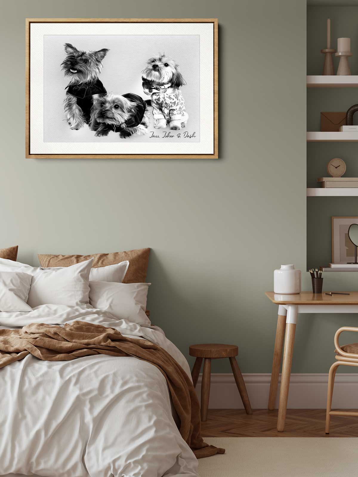 a cozy bedroom scene with a framed black and white photograph of three dogs on the wall above a bed with white bedding.