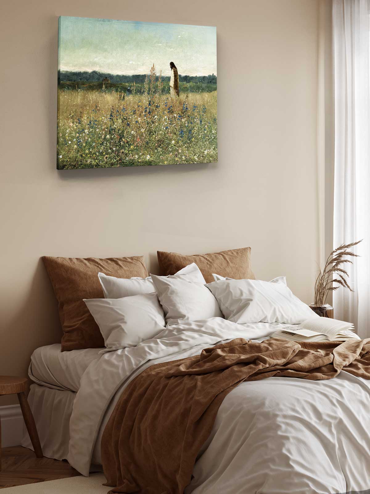 a serene bedroom scene with a bed adorned with white linens and brown throw pillows, and a painting of a woman standing in a field of flowers hanging above the bed.