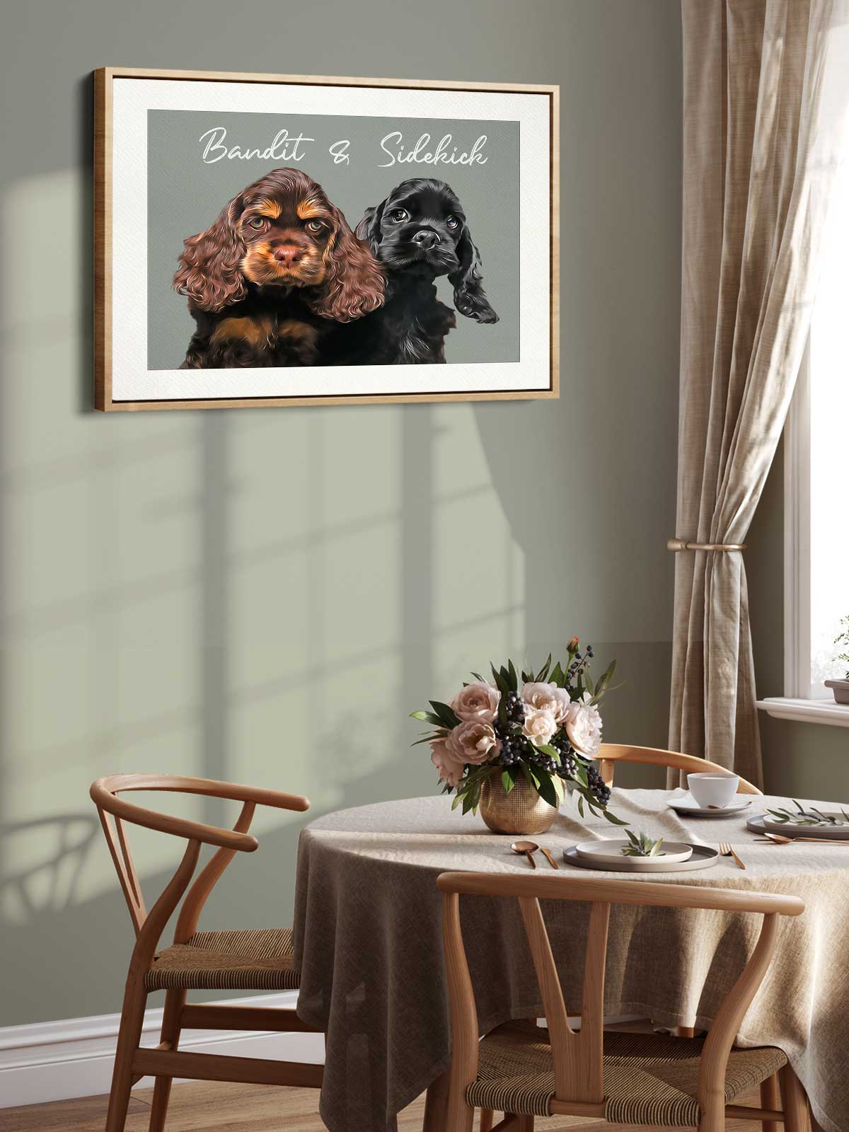a framed picture of two dogs, one brown and one black, sitting together on a table with a vase of flowers in front of them.