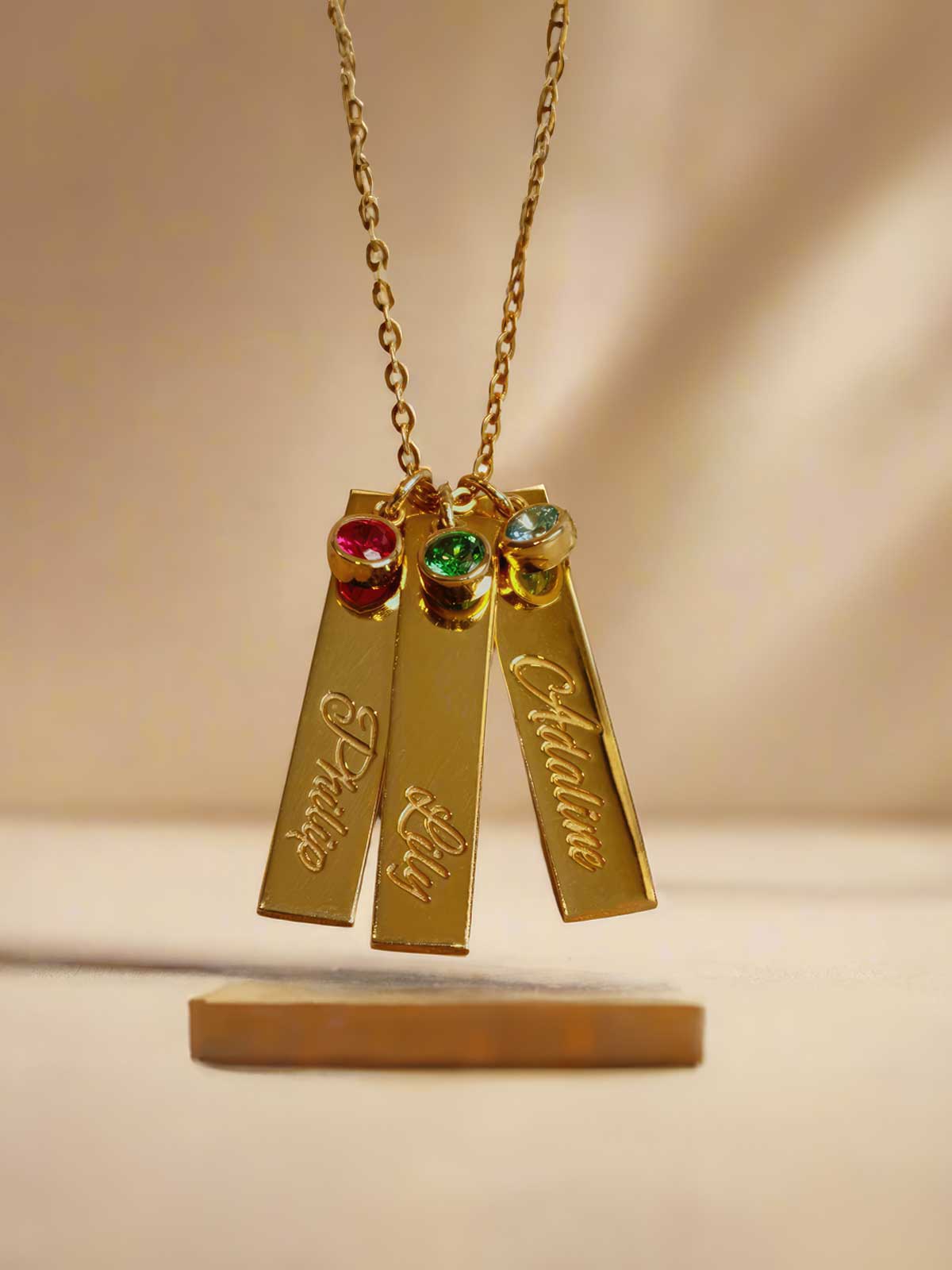 a couple of necklaces sitting on top of a table