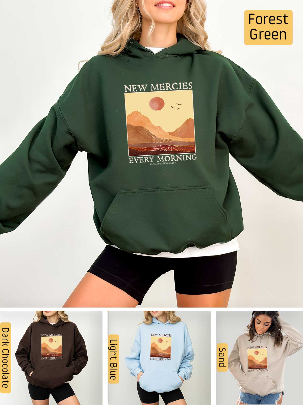 a woman wearing a new mercies sweatshirt and shorts