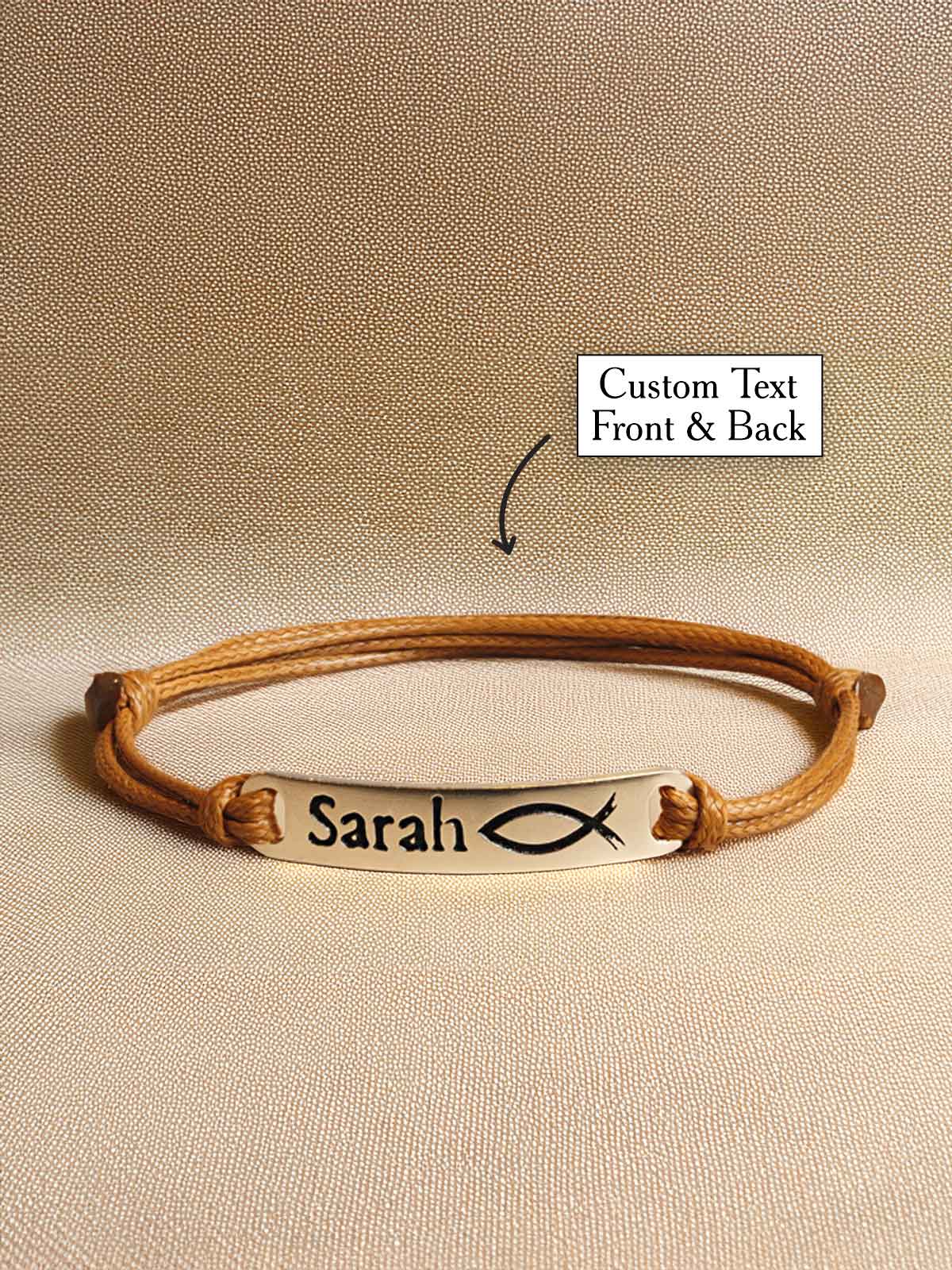 a leather bracelet with a name tag on it