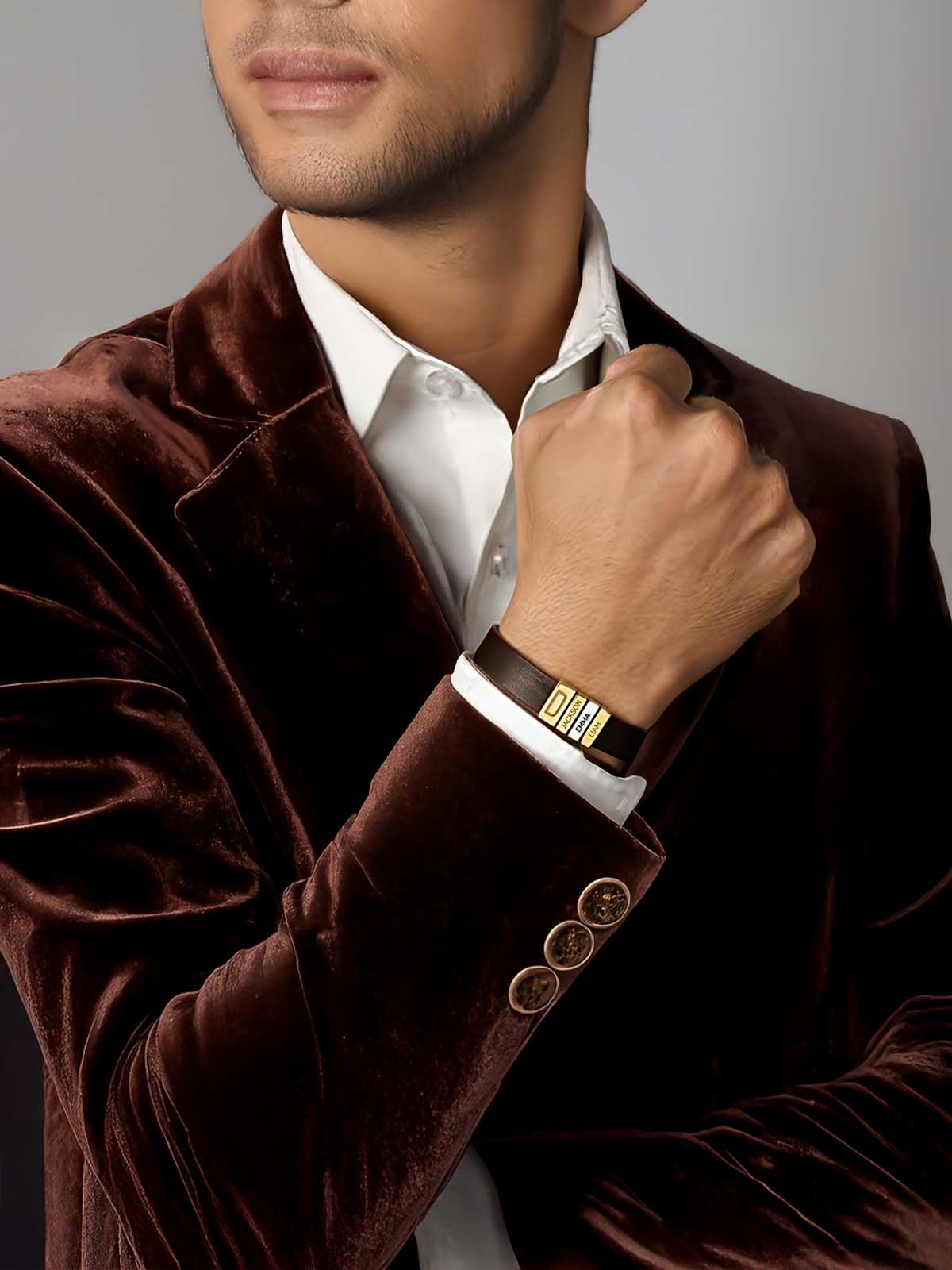 a man wearing a brown velvet jacket and white shirt