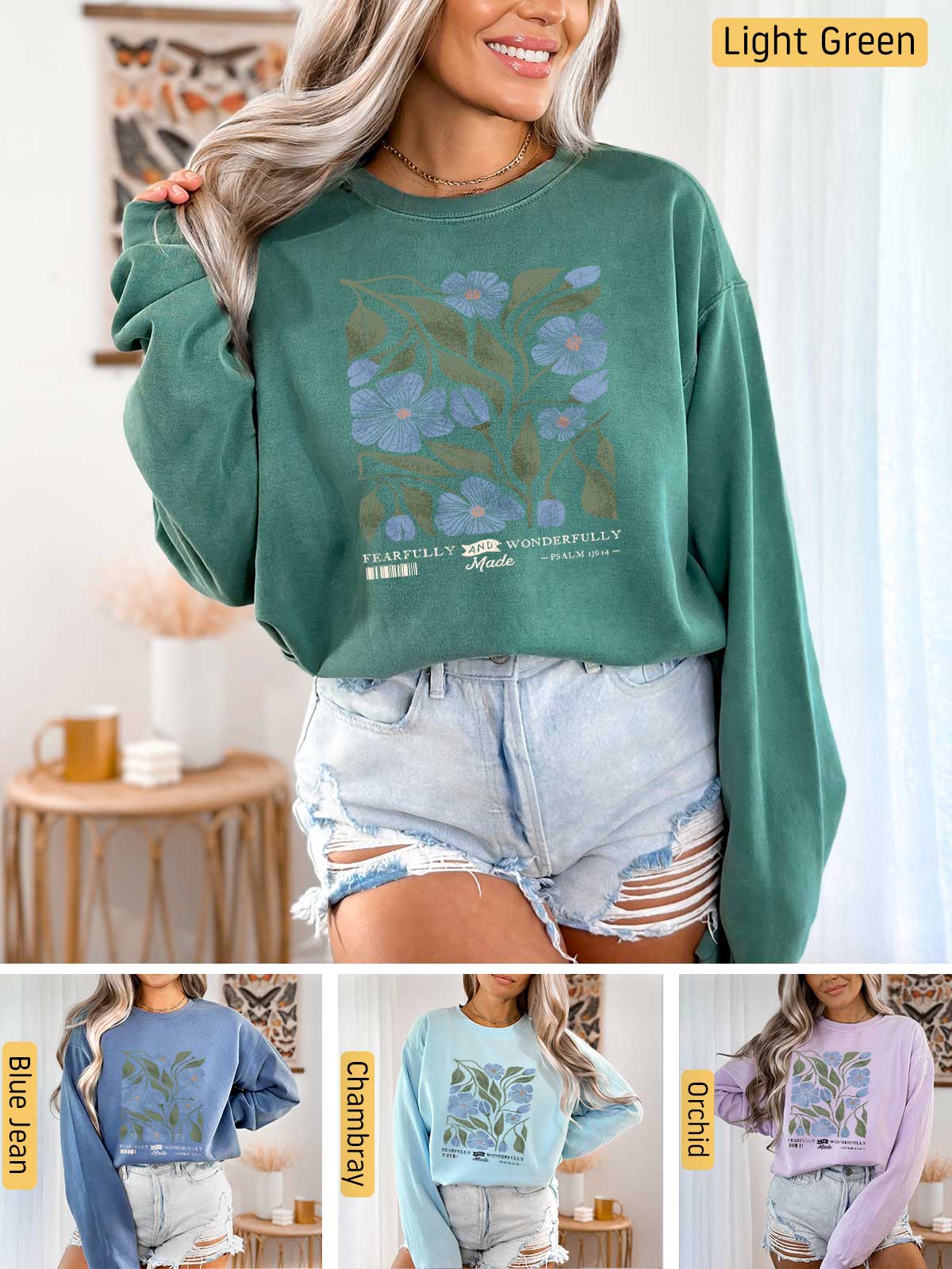 a woman wearing a green sweatshirt with blue flowers on it